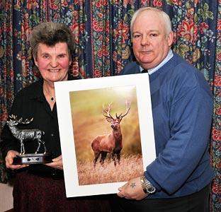 Margaret Warren accepted the award on  behalf of  Larry Bedigan